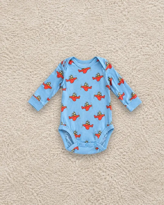Body à motif d'avions sur fond moquette